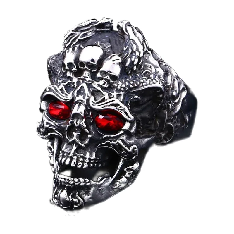 Anello Statement con tre teschi e pietre rosse, acciaio inossidabile